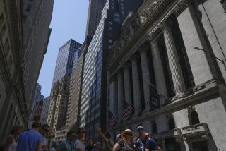 People walk around the front of the New York Stock Exchange in New York, Friday, June 2, 2023. (AP Photo/Seth Wenig)