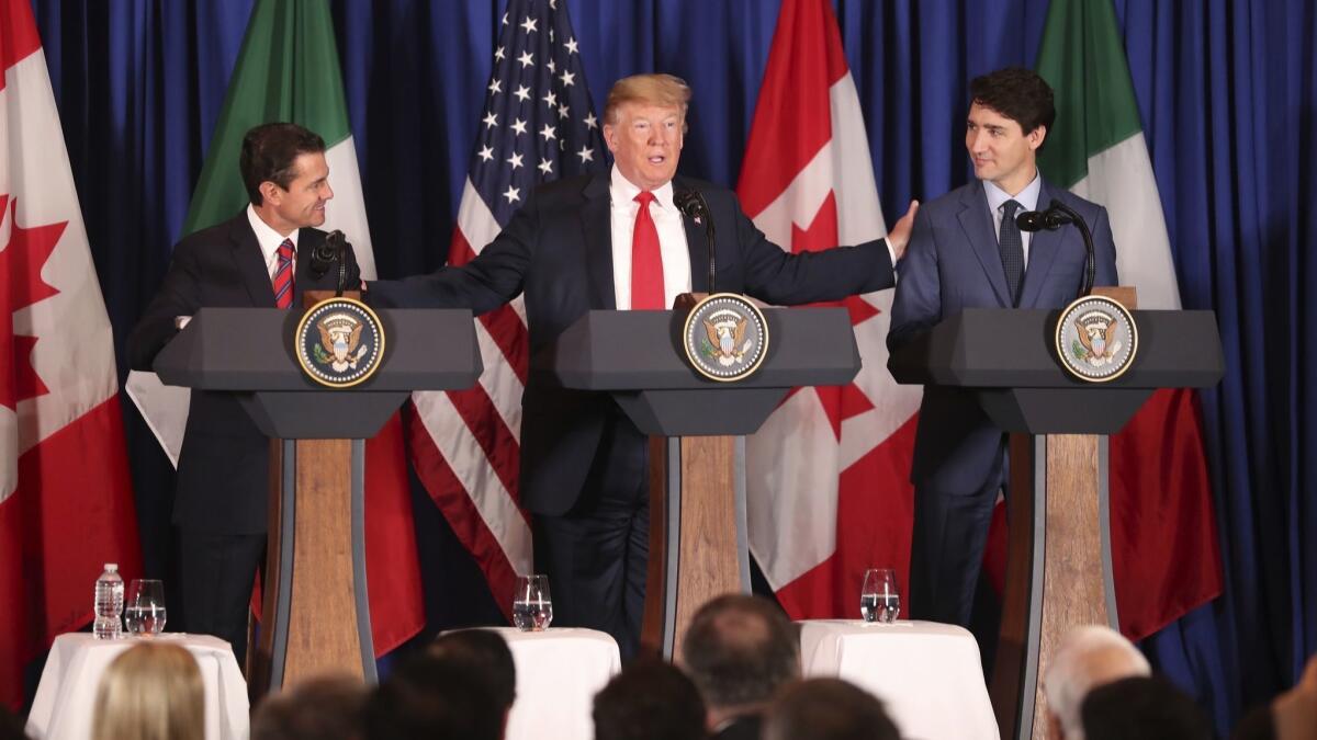 President Trump with Mexico's President Enrique Peña Nieto, left, and Canada's Prime Minister Justin Trudeau in 2018.
