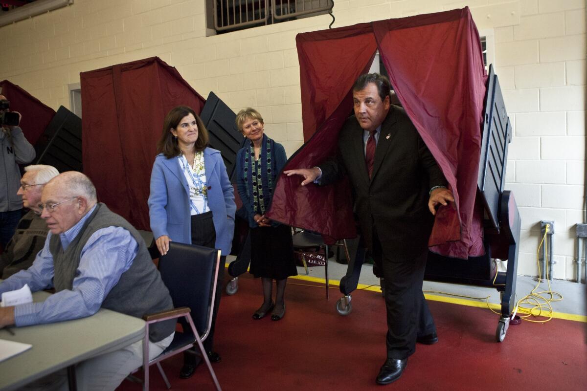 New Jersey Gov. Chris Christie exits a voting booth after casting his ballot for New Jersey governor.