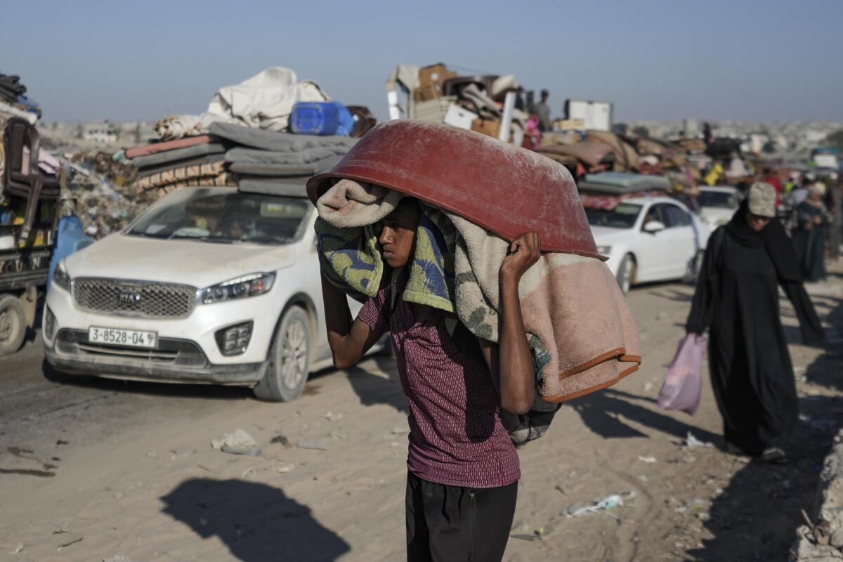 A Palestinian youth flees the Khan Younis area of the Gaza Strip.