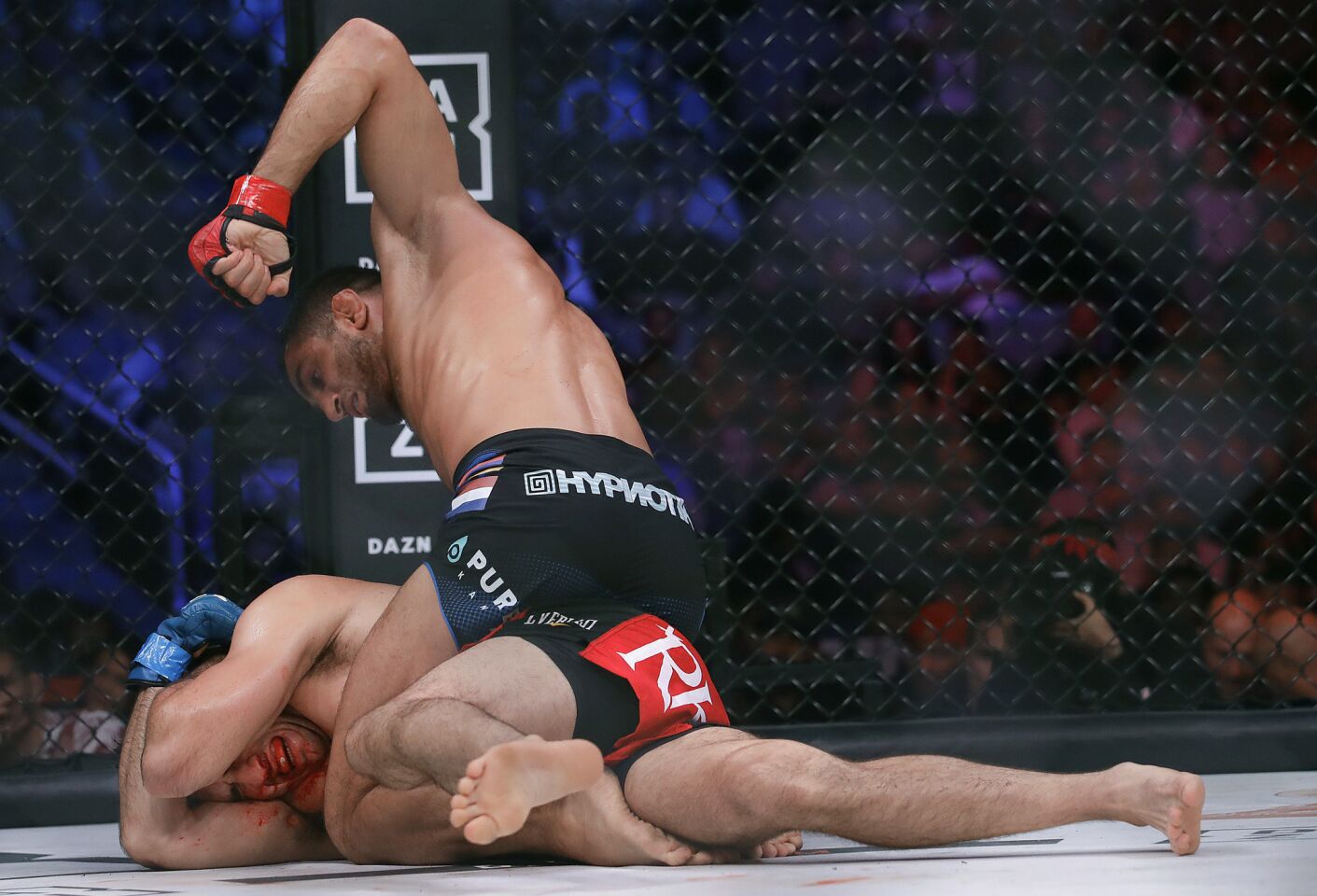 Gegard Mousasi, top, punches Rory MacDonald during a middleweight world title mixed martial arts bout at Bellator 206 in San Jose, Calif., Saturday, Sept. 29, 2018. Mousasi won by technical knockout in the second round to retain the title. (AP Photo/Jeff Chiu)