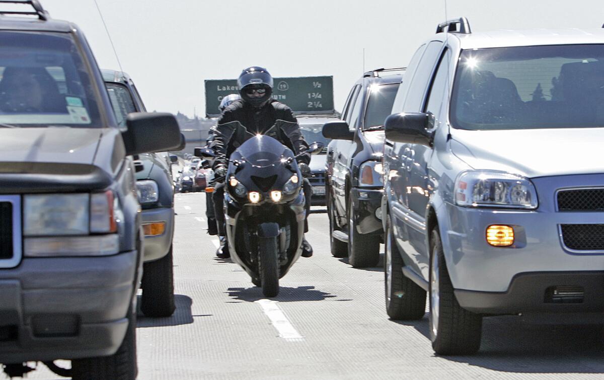 Motorcyclists heading south on the 405 Freeway engage in the practice known as lane-splitting or lane-sharing. The CHP and the DMV have recently withdrawn online safety guidelines for the practice.