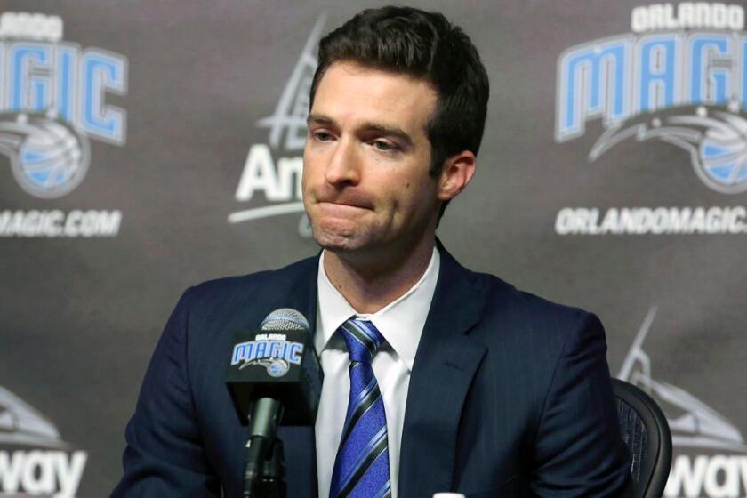 FILE - In this Feb. 5, 2015, file photo, Orlando Magic general manager Rob Hennigan pauses to answer a question during a news conference in Orlando, Fla. The Orlando Magic have fired general manager Rob Hennigan after missing the postseason for five straight seasons. The team confirmed the dismissal on Thursday, April 13, 2017. (Stephen M. Dowell/Orlando Sentinel via AP, File)