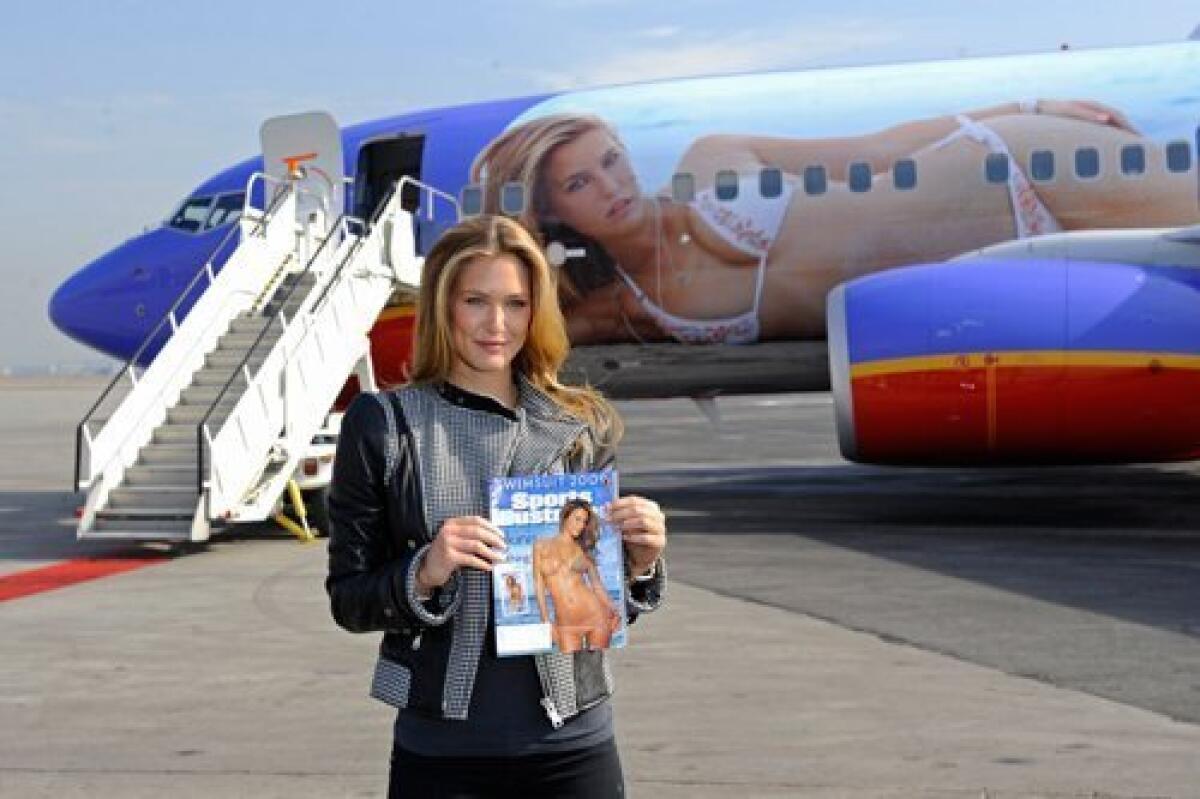 Sports Illustrated swimsuit edition cover model Bar Rafaeli recently got her wings, courtesy of Southwest Airlines, which has draped her teensy-weensy-bikinied body over the fuselage of a 737 jet, renamed "S.I. One."