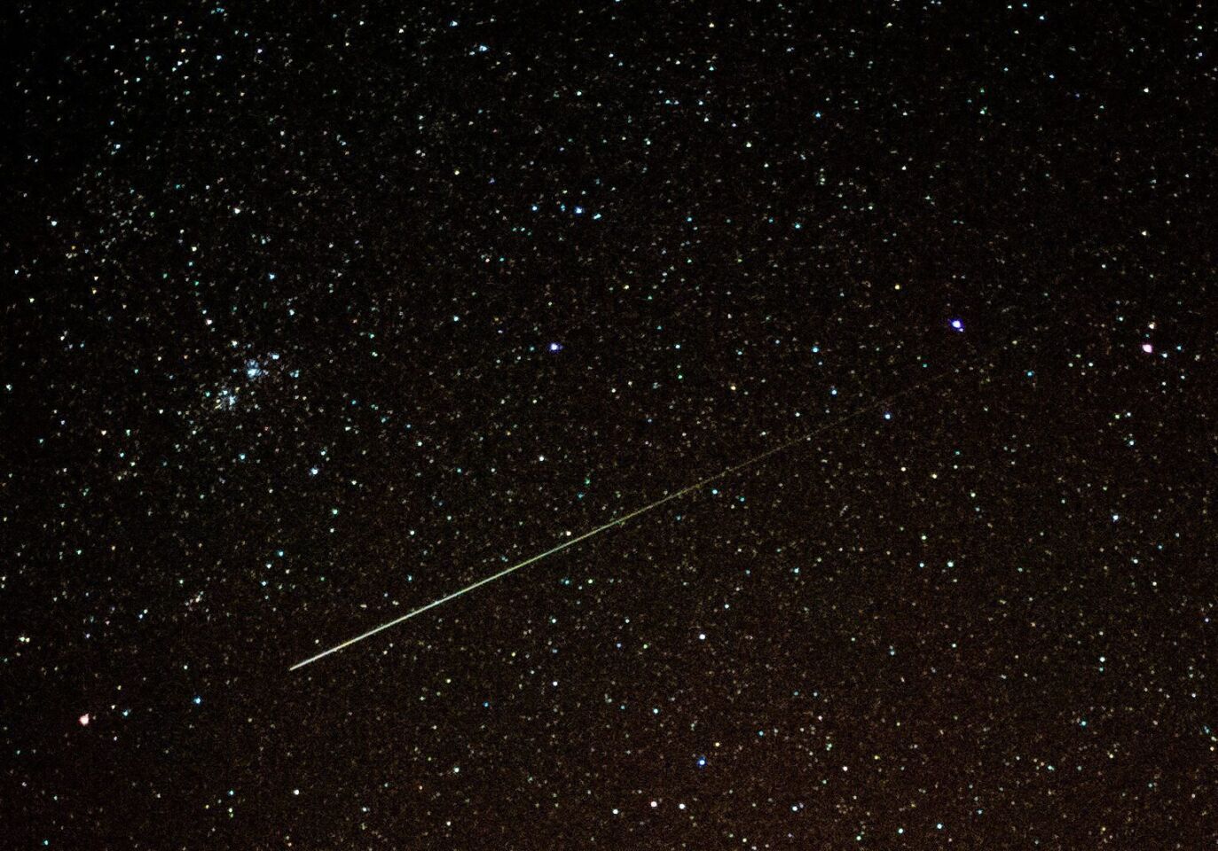 A shooting star illuminates the night sky near Sieversdorf, Germany.
