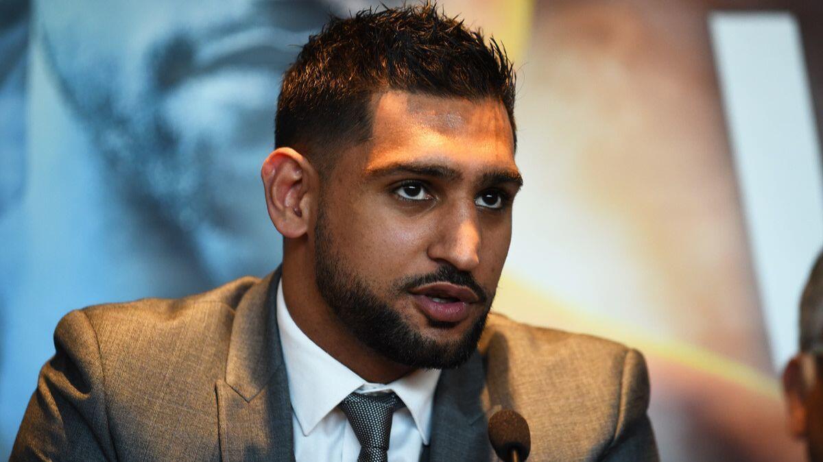 Amir Khan speaks during a news conference on June 28.