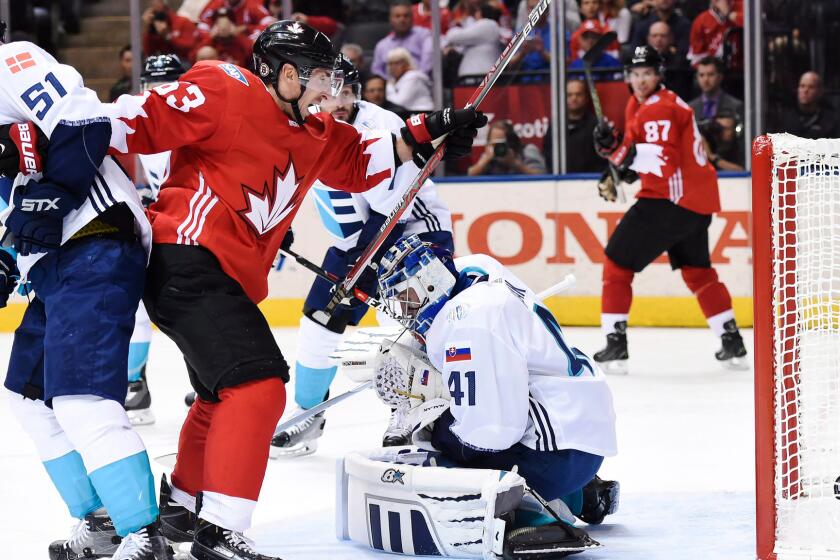 Team Canada's Brad Marchand (63) celebrates after a goal by teammate Patrice Bergeron (not pictured) against Team Europe goalie Jaroslav Halak on Sept. 27.