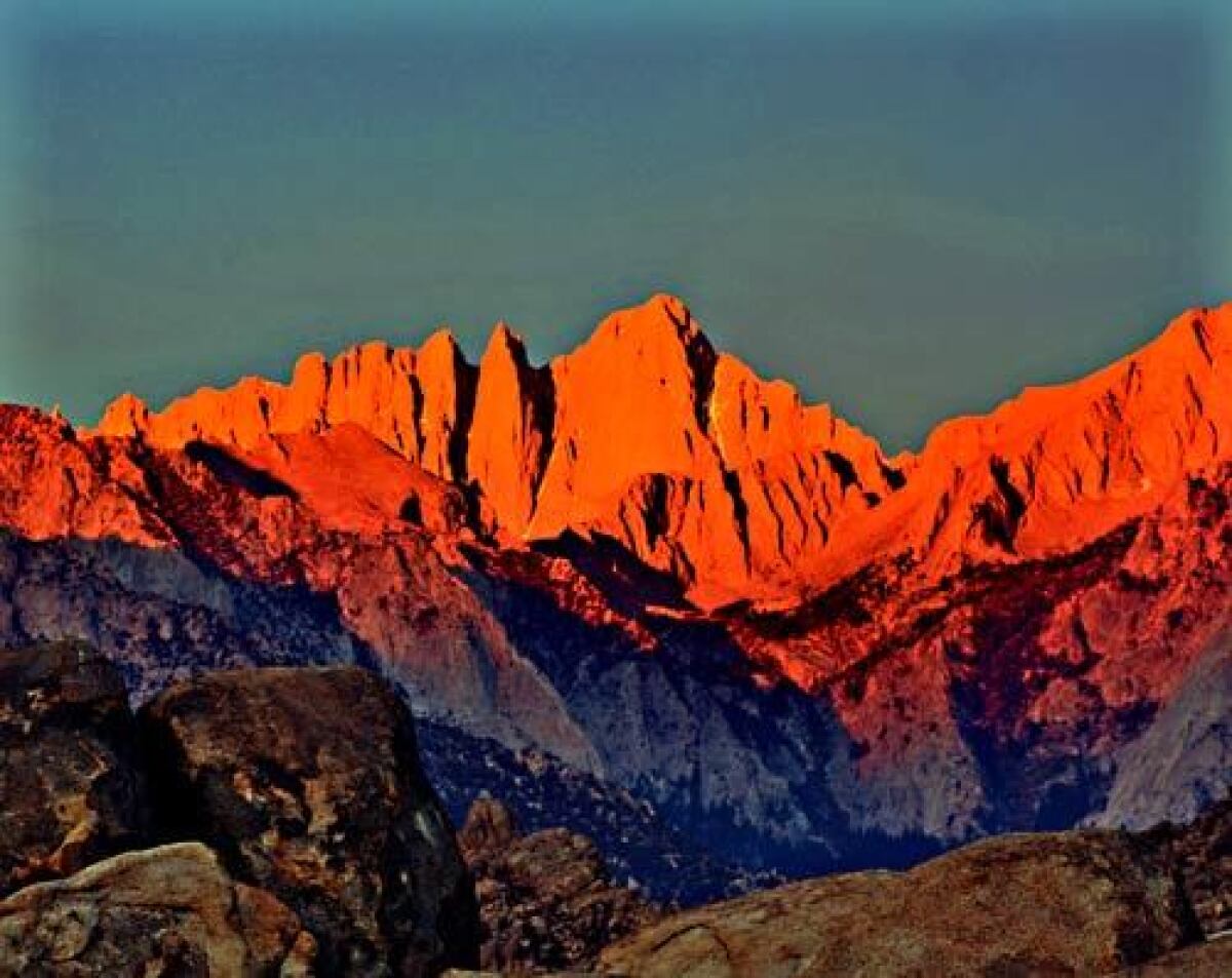 Sunset paints Mt. Whitney with a late light golden glow.