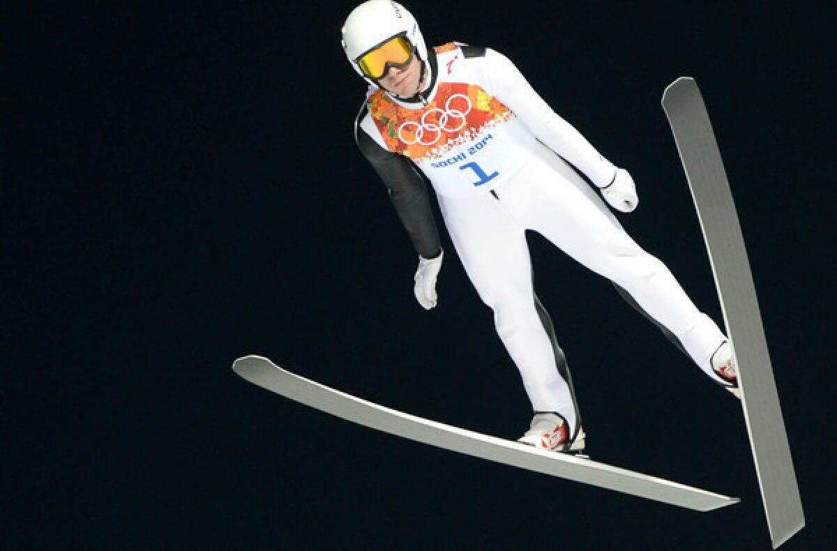 American Nicholas Alexander competes ski jumping qualification round on the normal hill Saturday at the RusSki Gorki Jumping Center.