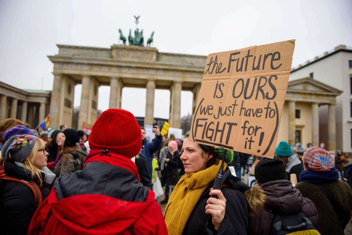 Demonstrators take part in a protest of the U.S. Democrats Abroad in front of the Brandenburg Gate in Berlin.