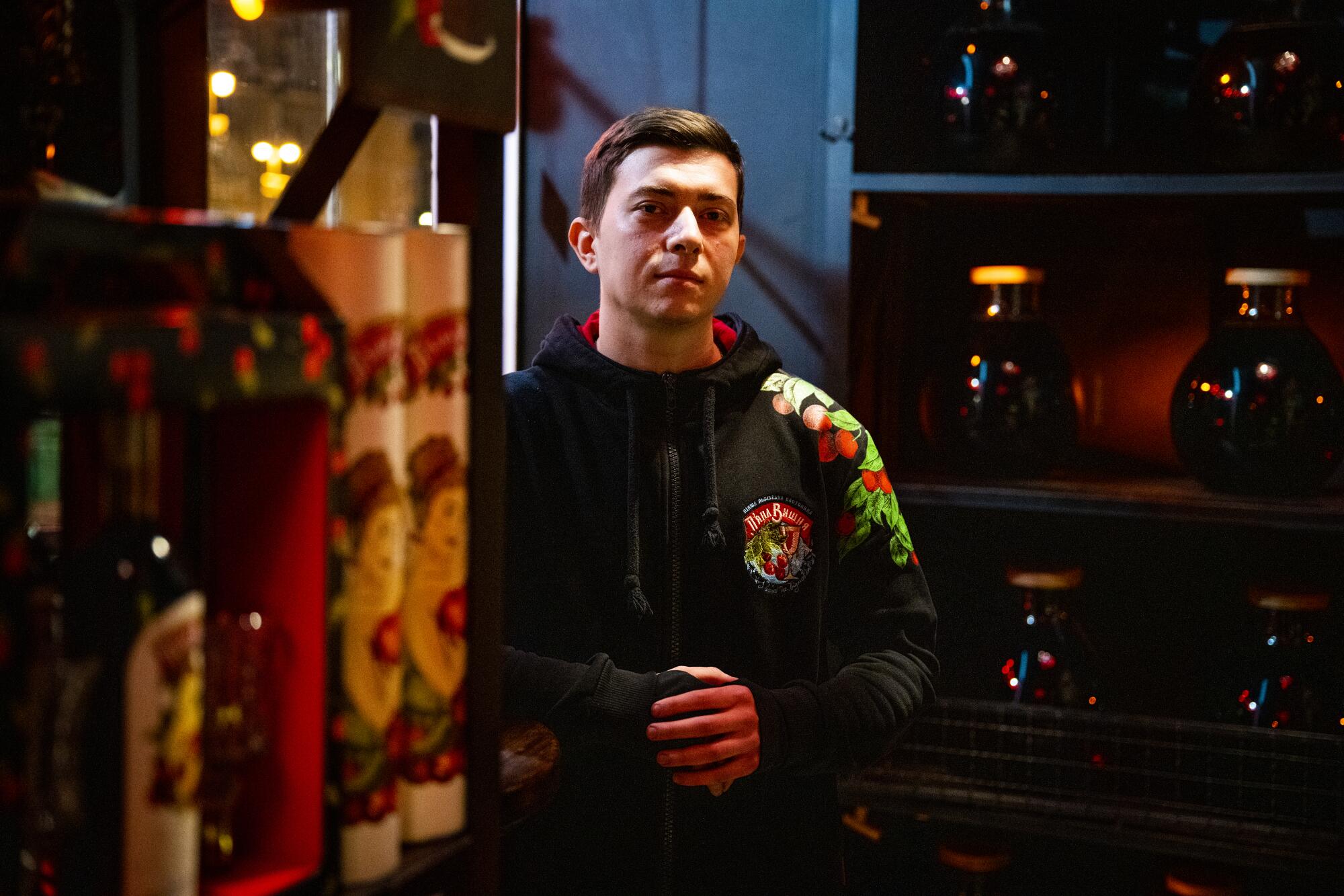 A man in his 20s at a bar