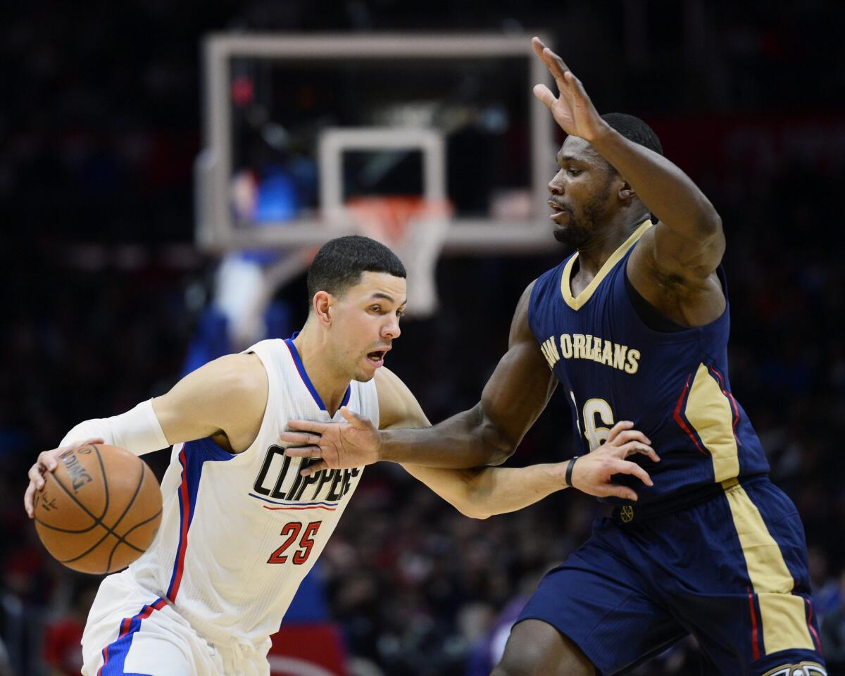 Clippers guard Austin Rivers works against Pelicans guard Toney Douglas during the first half of a game on Nov. 27.