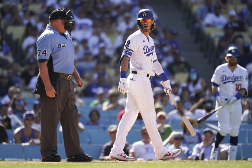 Cody Bellinger, center, disputes a call with home plate umpire Sam Holbrook during a 5-0 loss.