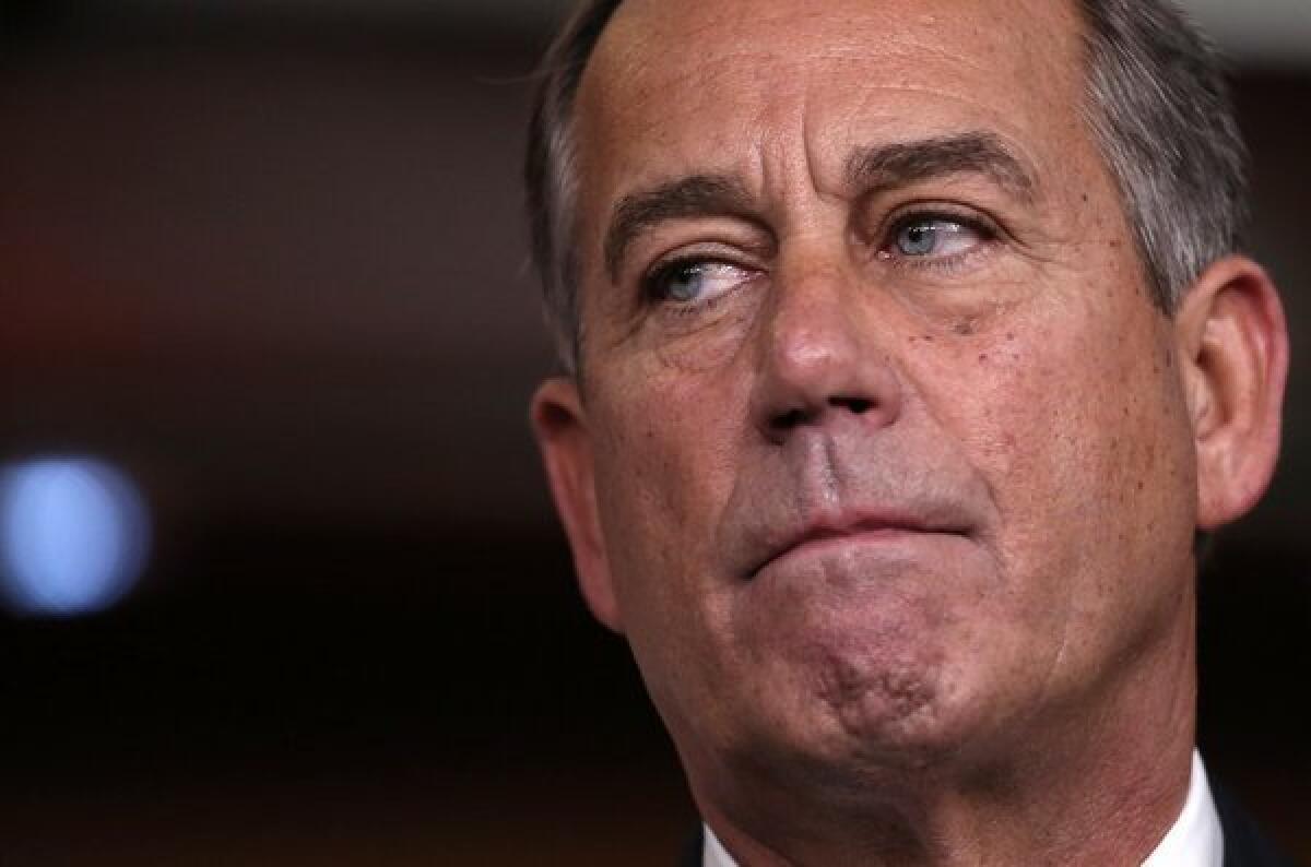 Speaker of the House John A. Boehner (R-Ohio) speaks to reporters Friday in Washington about his inability to attract enough GOP votes to pass his tax plan.