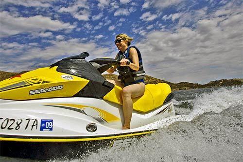 Susan Carpenter rides a Sea-Doo at Silverwood Lake State Recreation Area in Hesperia, Calif. The L.A. Times reporter was out to write a story about watercraft fun -- and to confront her fear of the water.