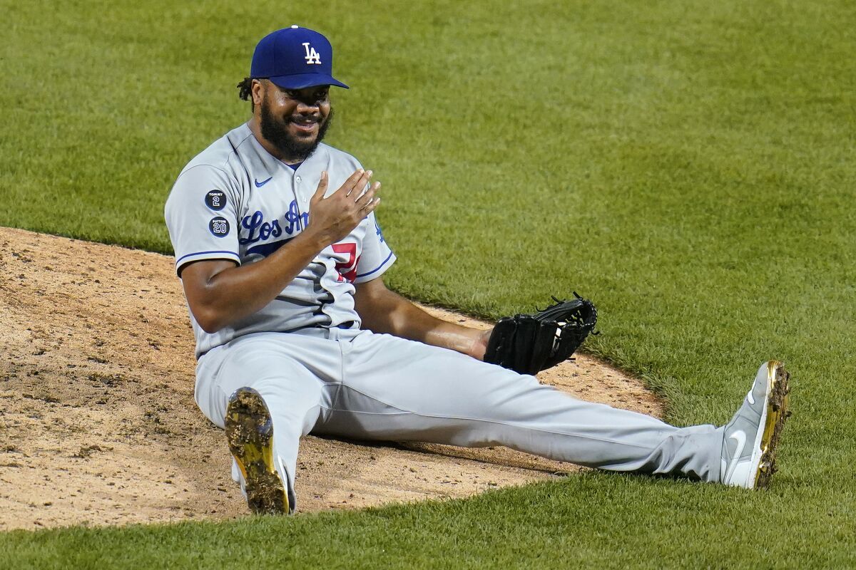 Dodgers relief pitcher Kenley Jansen smiles after catching a comebacker.
