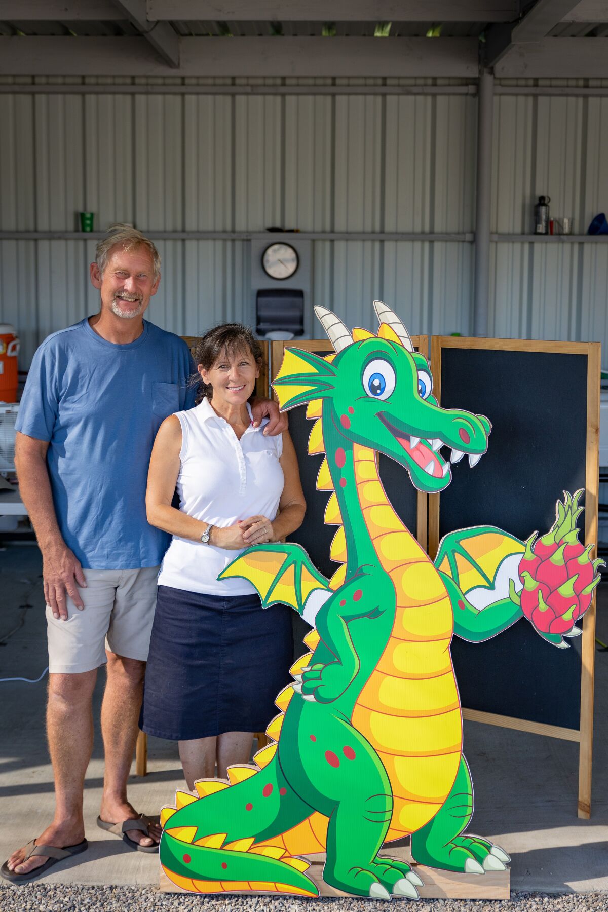 Kevin and Betsy Brixey hang out with the local dragon at their ranch in Ramona. 