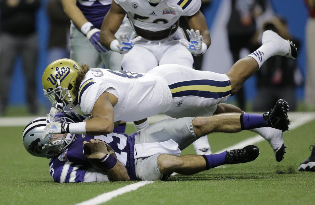 UCLA's Eric Kendricks sacks Kansas State's Jake Waters during the first half of the Alamo Bowl game on Jan. 2 in San Antonio.The UC regents on Thursday blocked a proposal that would have linked coaches' compensation to their teams' grades and graduation rates.