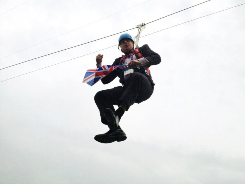 London Mayor Boris Johnson dangles from a zip line in London's Victoria Park after an Aug. 1, 2012, publicity stunt for the Olympic Games went awry.