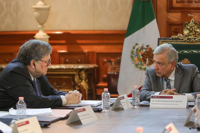 This handout photo released by the Mexican presidency shows President Andres Manuel Lopez Obrador (R) and U.S. Attorney General William Barr during a meeting at the Palacio Nacional, in Mexico City on December 5, 2019. (Photo by HO / Mexican Presidency / AFP) / RESTRICTED TO EDITORIAL USE - MANDATORY CREDIT "AFP PHOTO / MEXICAN PRESIDENCY" - NO MARKETING NO ADVERTISING CAMPAIGNS - DISTRIBUTED AS A SERVICE TO CLIENTS (Photo by HO/Mexican Presidency/AFP via Getty Images) ** OUTS - ELSENT, FPG, CM - OUTS * NM, PH, VA if sourced by CT, LA or MoD **
