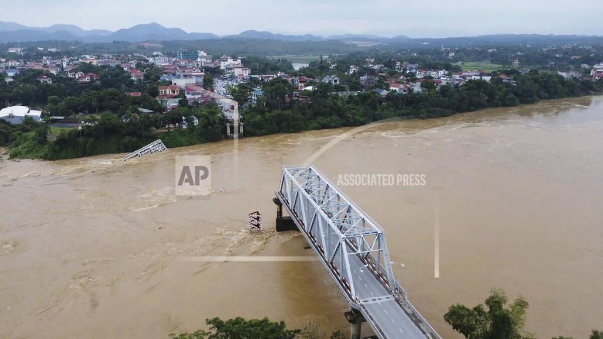 A bridge collapsed in brown water