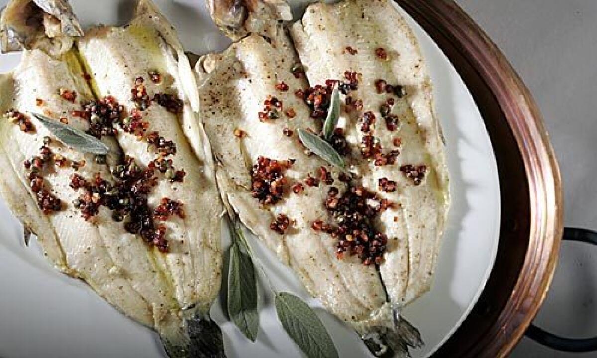 VIBRANT: A topping of pancetta, capers and sage is spooned over roasted trout fillets for a main course.