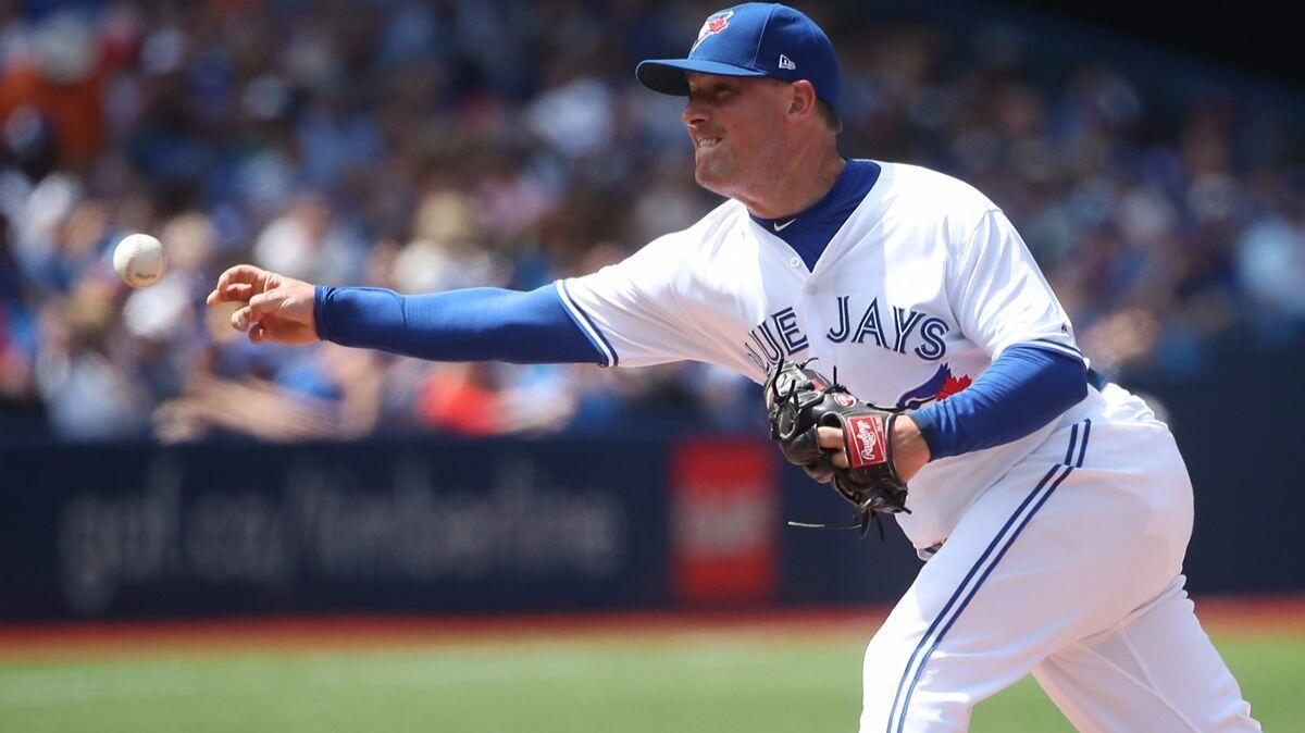Joe Smith delivers a pitch in the seventh inning during a game between the Toronto Blue Jays and the Oakland Athletics on Thursday. The Blue Jays traded Smith to the Cleveland Indians on Monday.