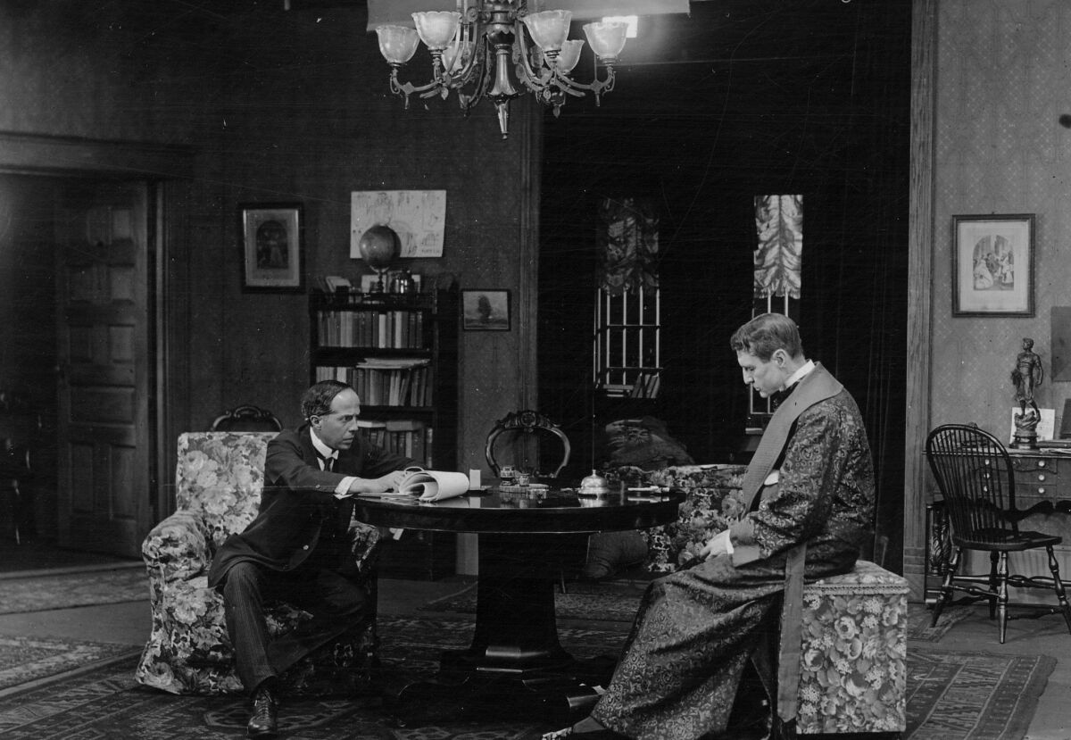 Director Arthur Berthelet, left, and actor William Gillette on the set of 1916's "Sherlock Holmes."