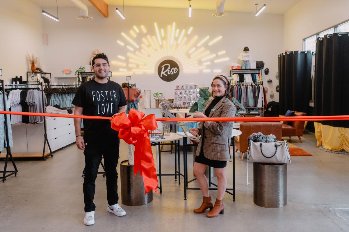 Founder Danny Mendoza joins Foster Love Executive Director Gianna Dahlia Mulkay at Rise Boutique.