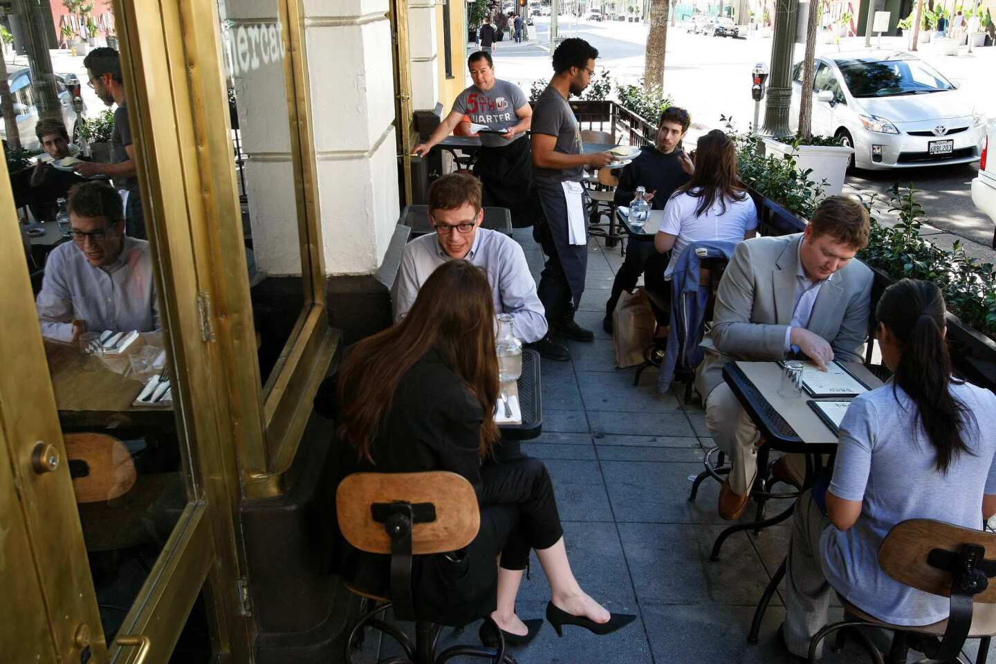 Outdoor tables offer a view of the downtown street scene.