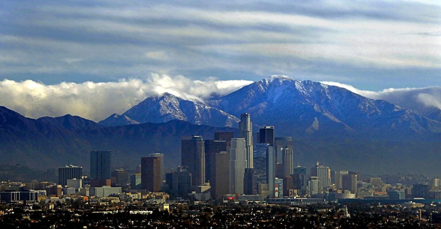 A long view of downtown Los Angeles framed by the San Gabriel Mountains. Home price index rise: 19.2%.