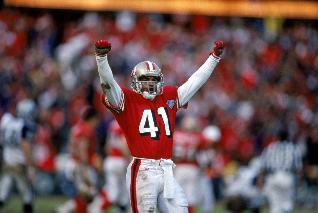 San Francisco 49ers cornerback Toi Cook celebrates on the field.