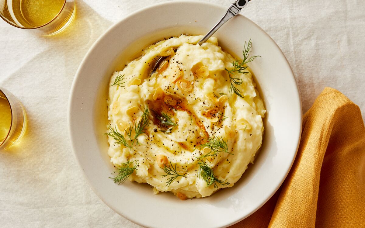 Labneh adds tang to creamy mashed potatoes, while sizzled garlic and butter add crunch and holiday richness.
