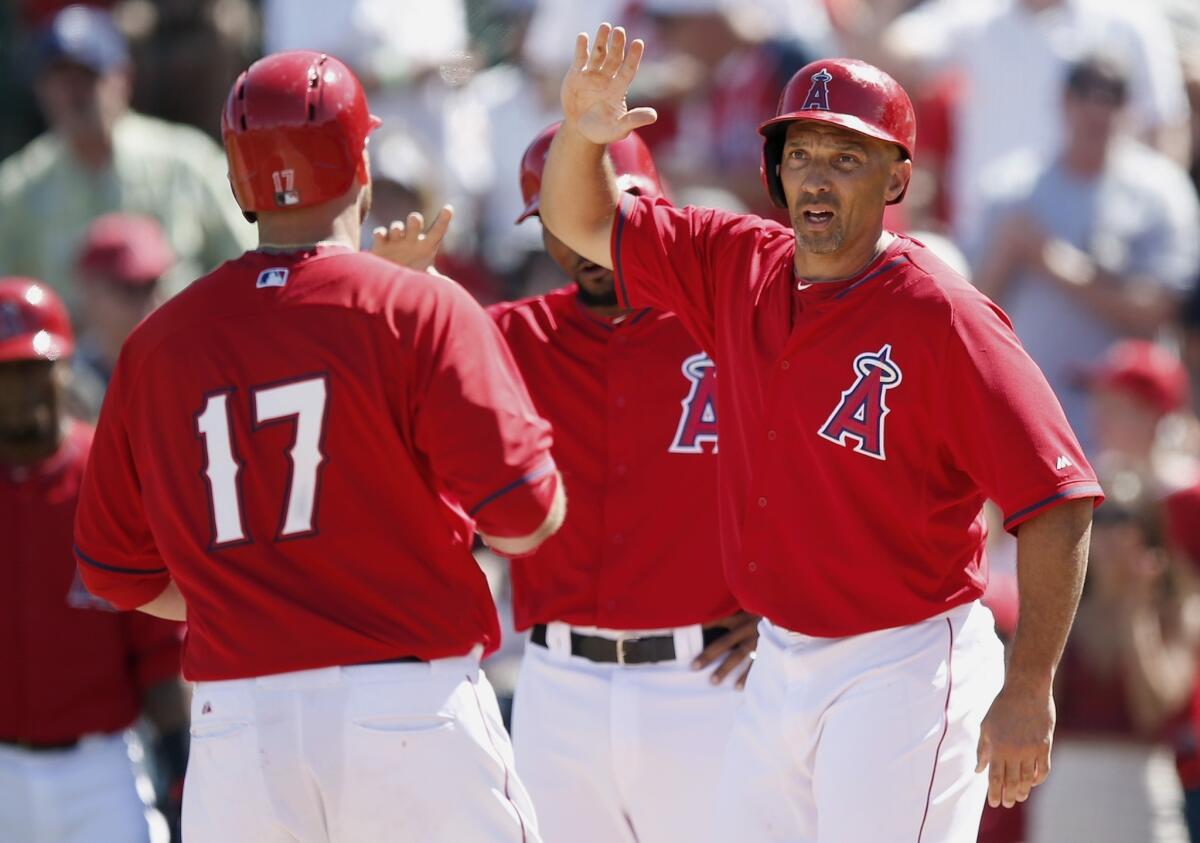 Chris Ianetta (17) is congratulated by Raul Ibanez, right, as he comes in to score after hitting a three-run home run in the second inning of the Angels' 7-3 win Friday over the Kansas City Royals.