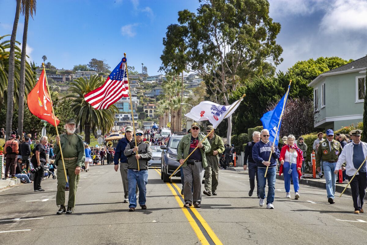 The South Orange County Vietnam Veterans march Saturday in the 55th annual Patriots Parade in Laguna Beach.