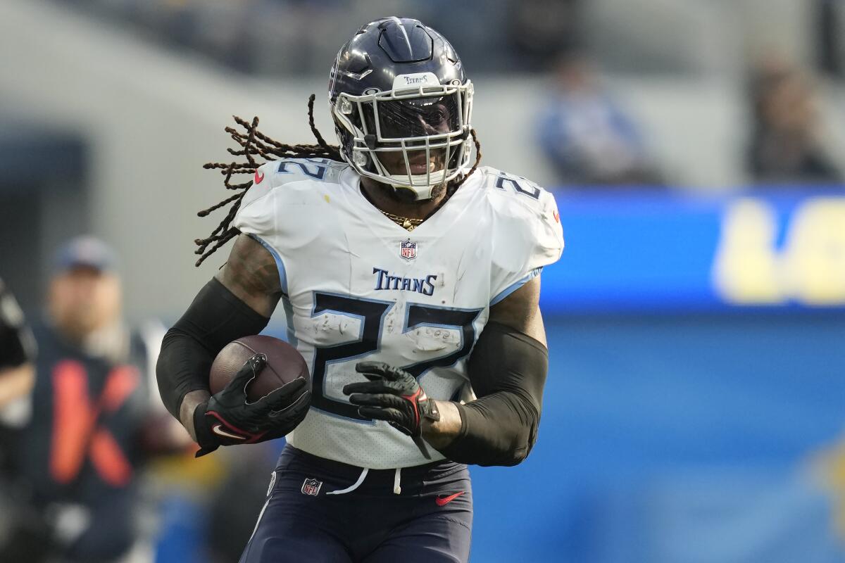 Tennessee Titans running back Derrick Henry carries the ball against the Chargers in the first half.