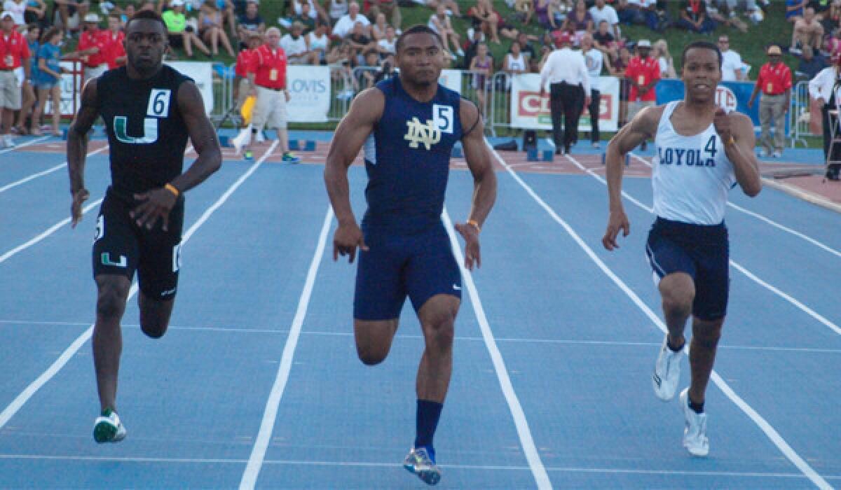 Khalfani Muhammad of Notre Dame wins the 100 meters at Saturday's CIF state track and field championships in Clovis. He also won the 200 to repeat in both events.