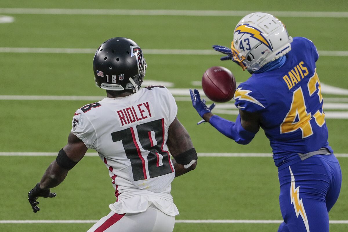Chargers cornerback Michael Davis intercepts a pass intended for Atlanta Falcons wide receiver Calvin Ridley.