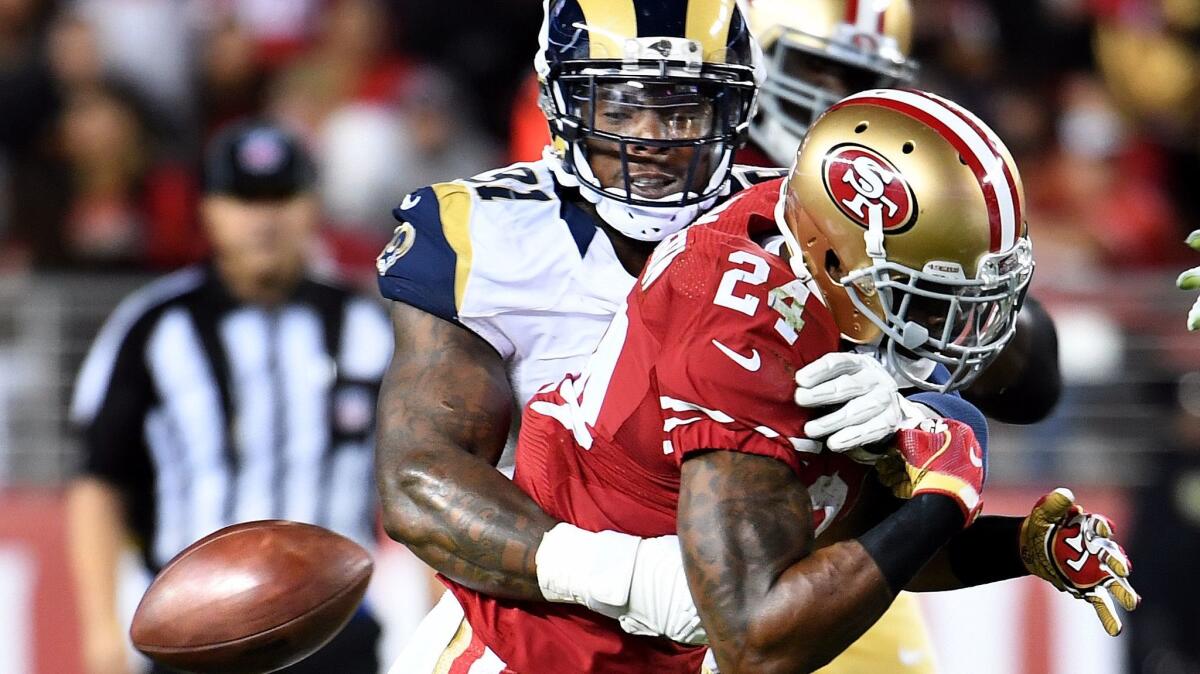 The Rams' Dominique Easley forces a fumble during a game against the 49ers last season.