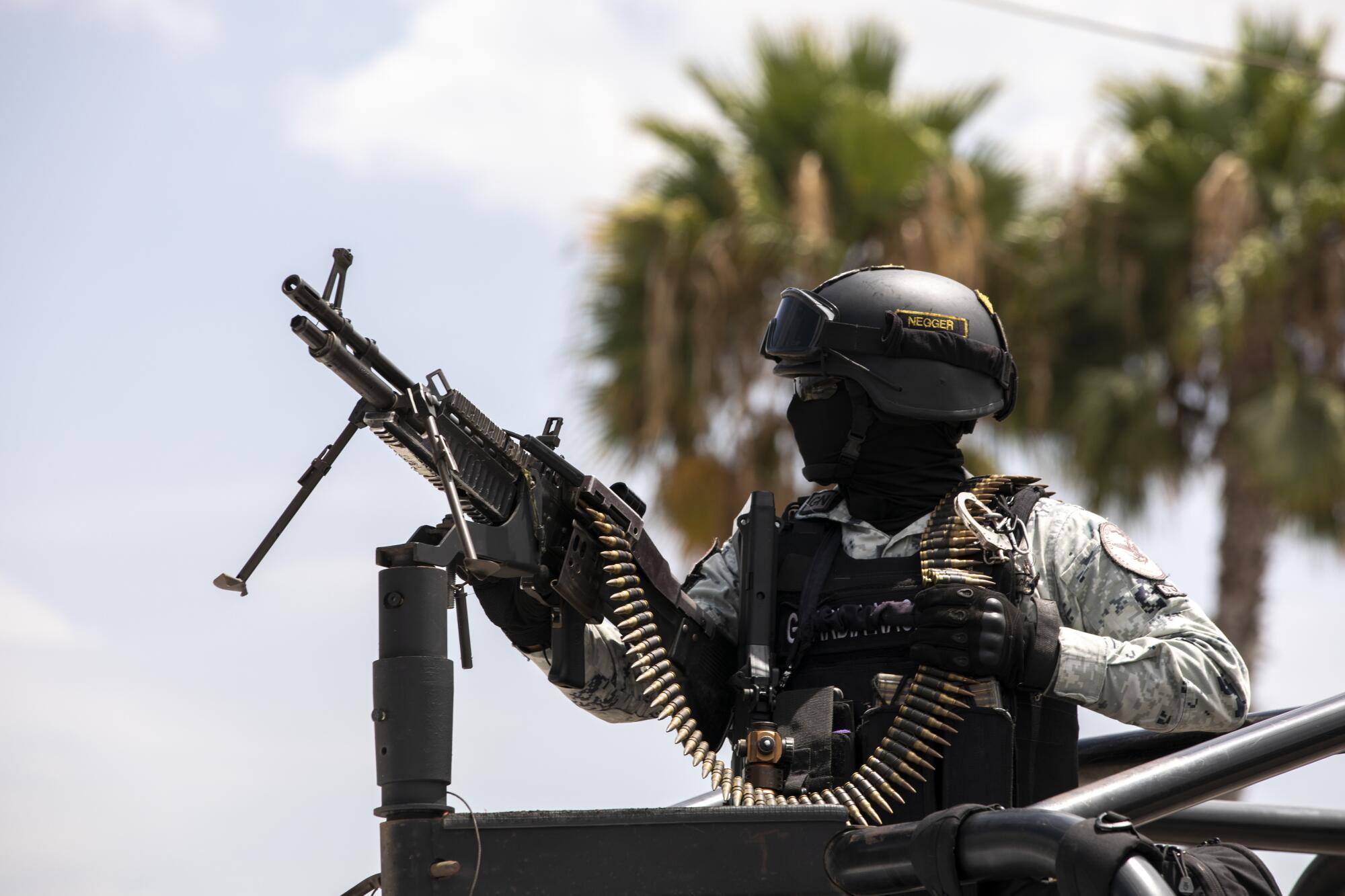 The Mexican National Guard with a gun and bullets.