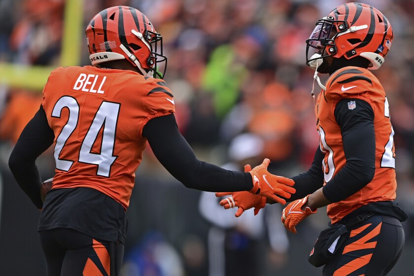 Cincinnati Bengals safety Vonn Bell, left, is congratulated by cornerback Eli Apple.