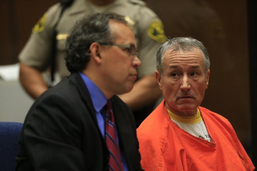 Former Miramonte Elementary School teacher Mark Berndt sits in court with his attorney, Manny Medrano, in November. Bernt pleaded no contest to 23 counts of lewd conduct with students. Lawmakers passed a measure Thursday that would speed the dismissal process for teachers accused of misconduct.