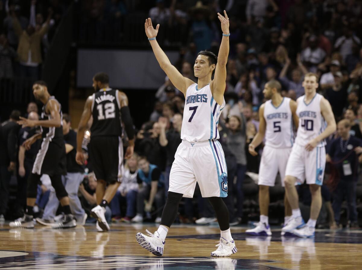 Hornets guard Jeremy Lin celebrates after a 91-88 victory over the Spurs.