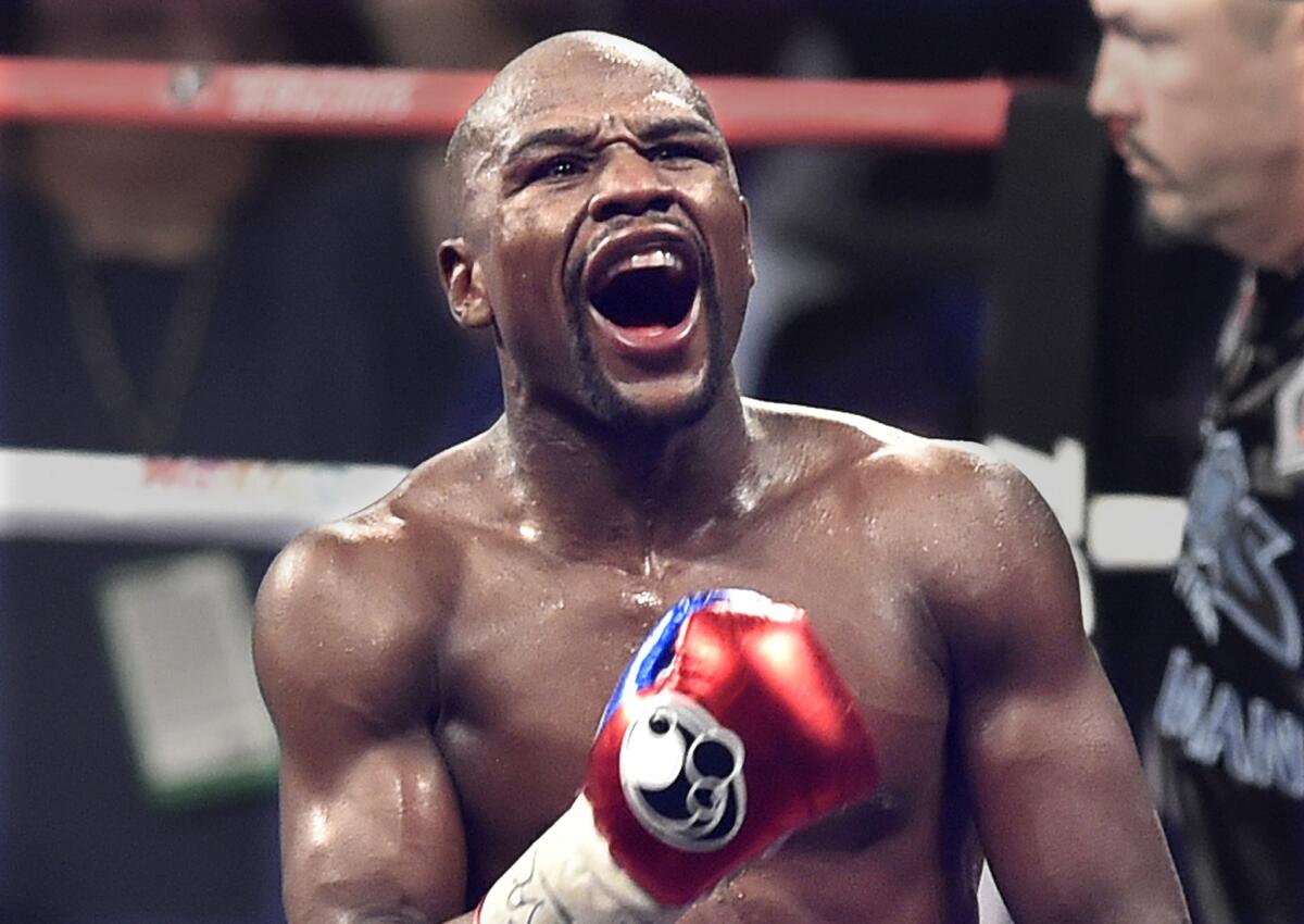 Floyd Mayweather celebrates during the World Welterweight Championship at the MGM Grand in Las Vegas on May 2.
