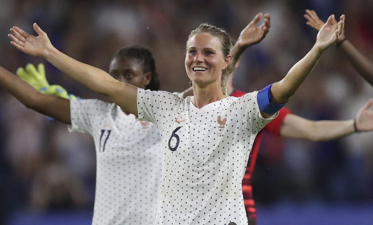 France's Amandine Henry celebrates at the end of a Women's World Cup round of 16 soccer match