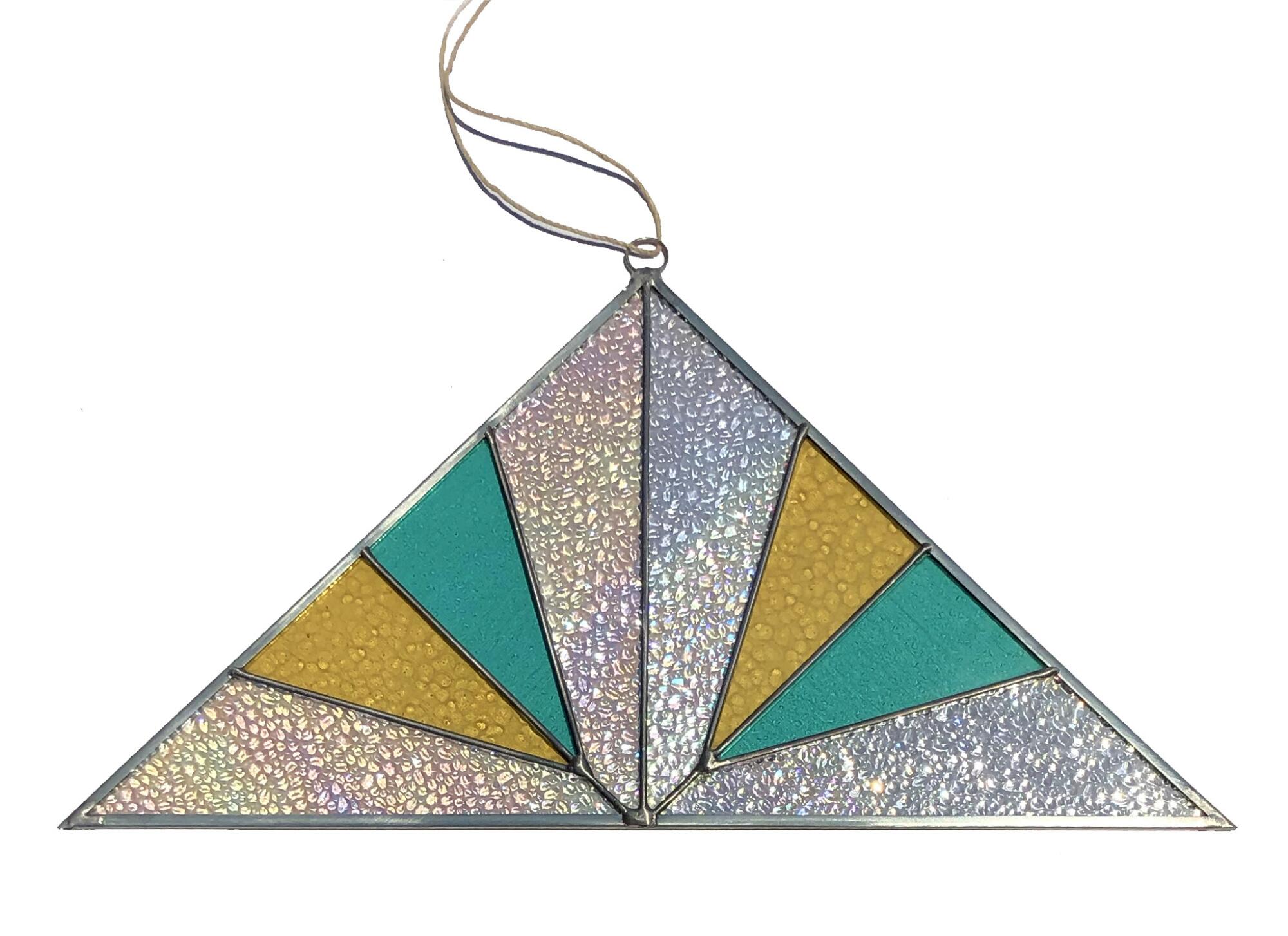 A triangular, stained-glass suncatcher.