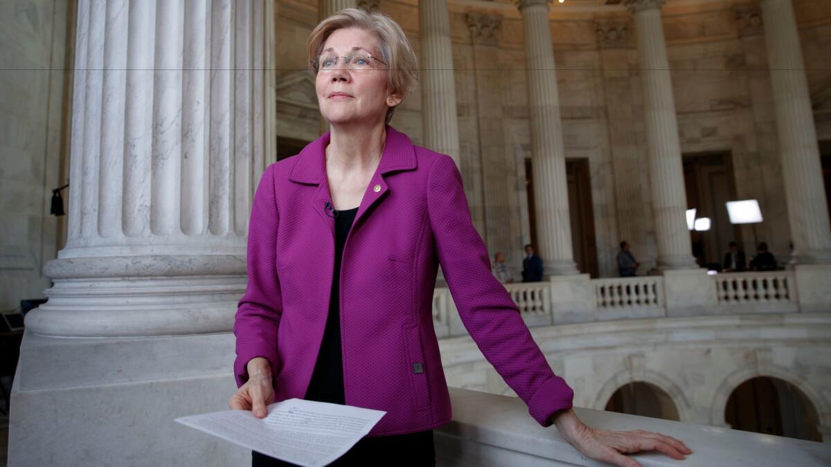 Sen. Elizabeth Warren (D-Mass.) holding a transcript of her speech in the Senate Chamber. Warren will publish a book in April.