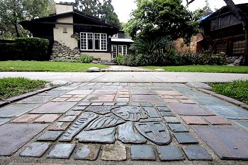 ECHOES: St. Mark's Lion by Ernest Batchelder, lines the walkway of Robert Winter's Pasadena home.
