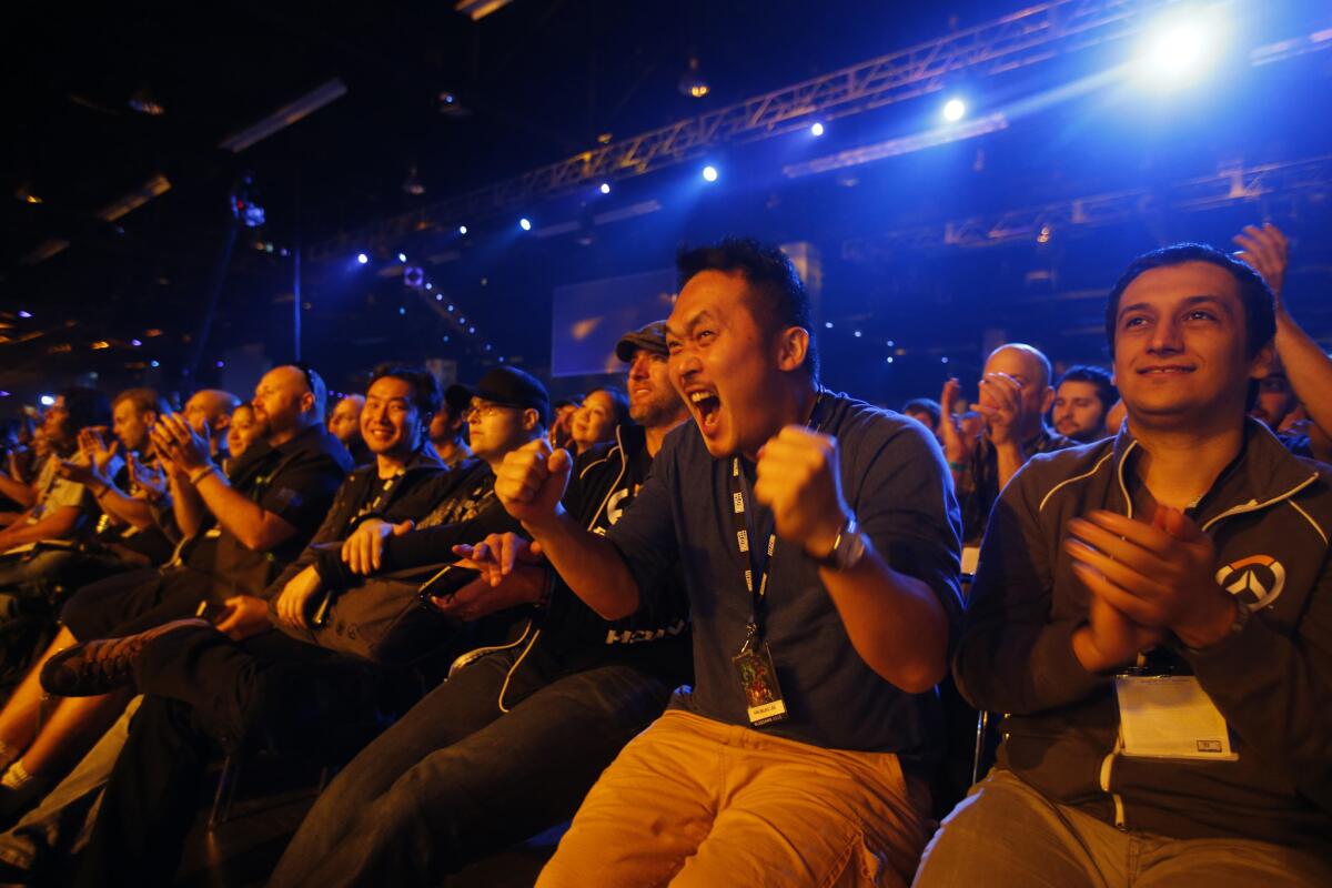 Video game fans show their enthusiasm at Blizzard Entertainment's annual fan convention and gaming tournament in November.