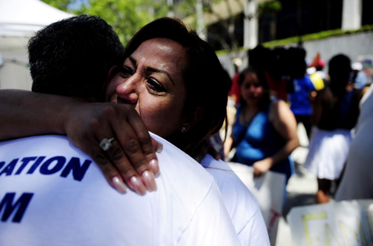 Maria Galvan hugs her husband, Luis Barajas, at the conclusion of a 24-hour vigil in Los Angeles after the Senate passed an immigration reform bill June 27. The pair reside in the country illegally.